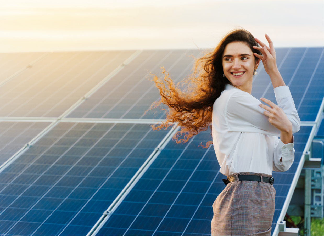 girl-standing-solar-panel-rows-during-sunset girl-standing-solar-panel-rows-during-sunset